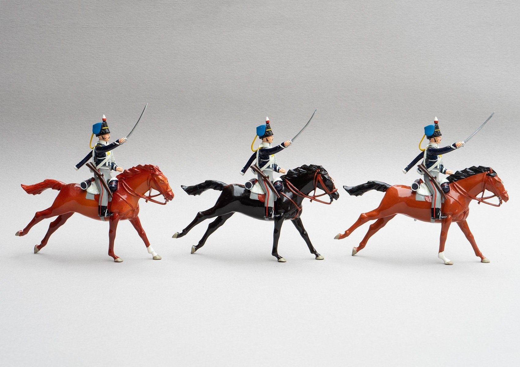 Set 148 18th Hussars, 1815 | British Cavalry | Napoleonic Wars | Three mounted cavalry troopers with rifles and sabres. Black fur caps with blue bags, and dark blue jacket with white looping | Waterloo | © Imperial Productions | Sculpt by David Cowe